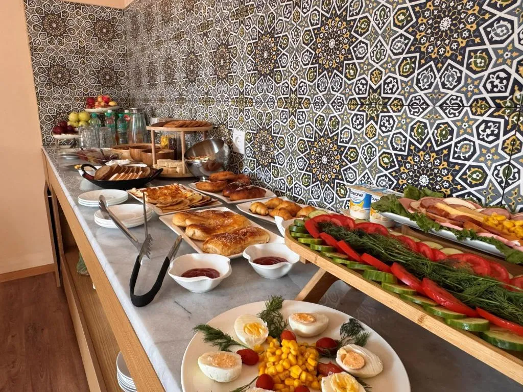 Breakfast spread with local pastries and fresh vegetables